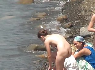 Public beach with sexy naked nudists