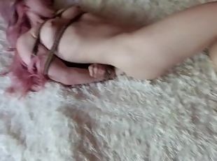 Submissive girl in rope bondage