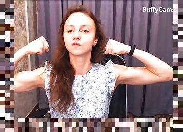 Teen girl flexing muscles