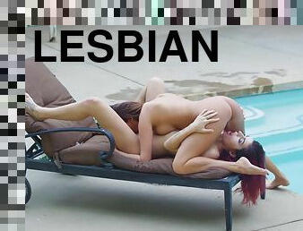 Two passionate Euro babes licking wildly by the pool