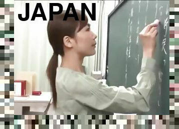 Japanese teacher gives a valuable lesson at the blackboard