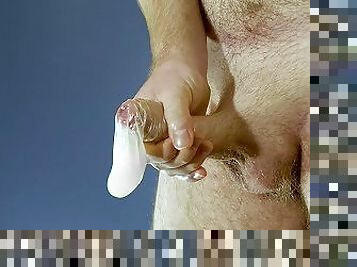 Filling up a condom and showing it off