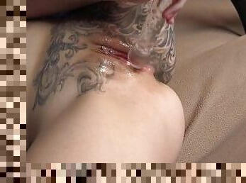 Solo tattooed redhead Taylor Nicole playing with glass dildo in 4L.