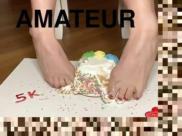 Crushing cake with feet