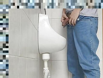 Risky jerk in public urinal at work