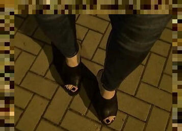 Crossdresser in very high platform shoes