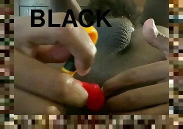 Playing with a black twink toy