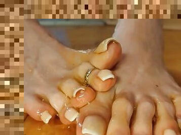 Wiggling long toes with French in Honey. Close up - Novem Olga