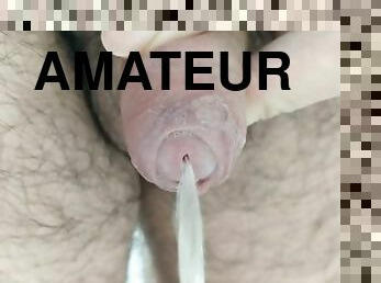 Close up cock pissing