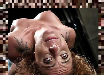 Curly redhead slave caned in hogtie