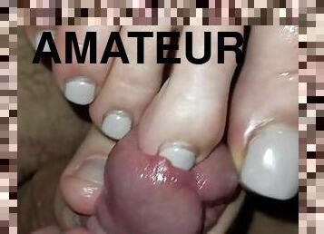 Teasing glans with her toenails and cumming on her sweaty soles