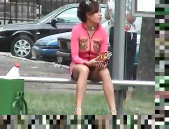Upskirt on a bus bench with a beauty