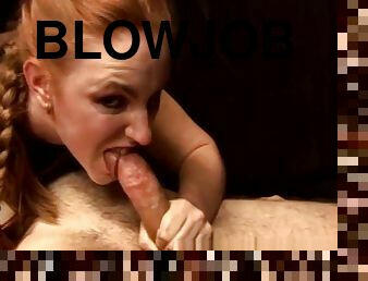 Breasty bimbo sucking and jerking a dick