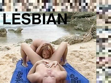Lesbians eat their fill of pussy at the beach.