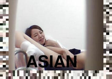 Asian teen masturbates
