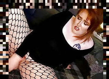 Lush British chick in ripped pantyhouses putting dildo deep