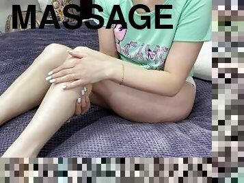 Massage of long legs. Cute girl shows her legs