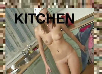 Blonde teen fingers her pussy on the kitchen counter top