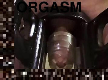 Man moaning while using cock milking machine