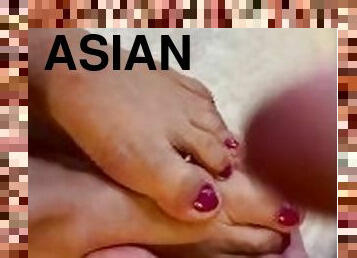 Pretty manicured Asian feet get a huge cum load