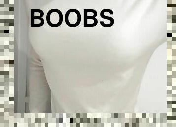 Fake boobs crossdresser is wearing sweater. Bra is seen through.