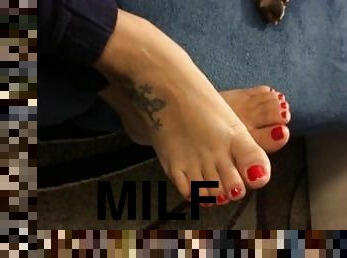 Milf shows her sexy feet with red nail polish,waiting for someone to lick them.....