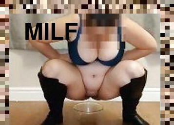 MILF wearing Knee high boots and pissing in a bowl