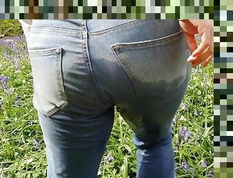 ? Blonde Girl Pissing Her Jeans Amongst The Flowers In Public!