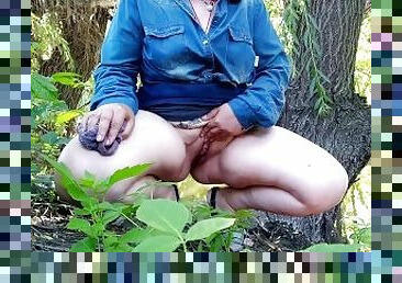 Hot MILF takes off her panties at the lake and pisses her legs spread wide