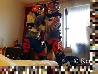 Ficht in motocross gear over who is going to be the bottom