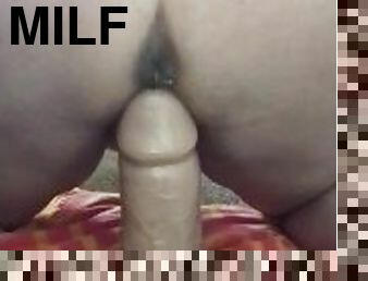 Squirting milf riding a thick dildo