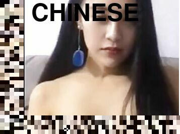 Chinese lady showing off her funbags live