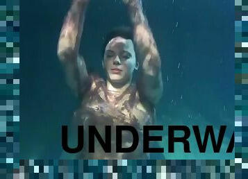 Dressed underwater beauty Bulava Lozhkova swims naked