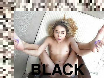 Cutie lies down under a black stud for a missionary fuck