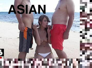Asian threesome outdoor on the beach