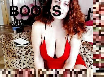 Red-haired lady plays with her boobs on webcam