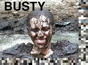 Busty Samantha gets very dirty outdoors in pool of mud