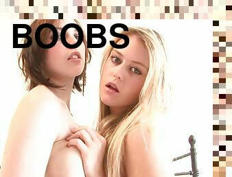 Pair of curvy teens rub their juicy tits in bedroom action
