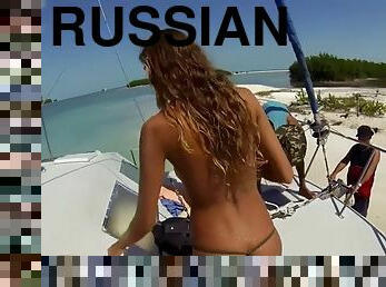 Topless russian swimming in tropical sea