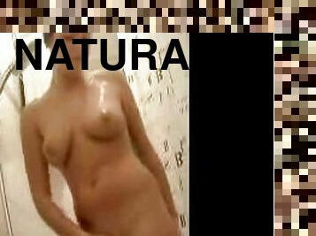 Natural breasts girl showers solo