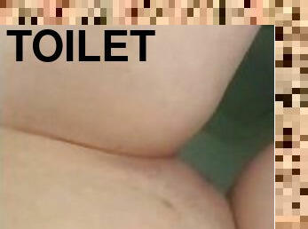 Sexy teen pisses on the toilet
