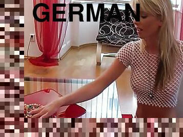 Round titted German blonde masturbating in the living room