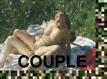 Couple in a grassy field has great anal sex