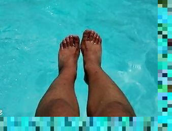 Feet in the pool with a lot of water