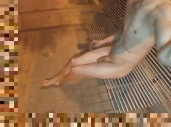 nude in public playing with a bottle of piss