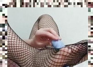 Horny girl jerking rubber cock in fishnet stockings