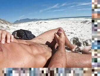 Muscle lad wanks on the beach with a view