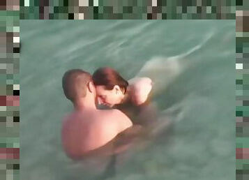 Mature couple sex in the sea