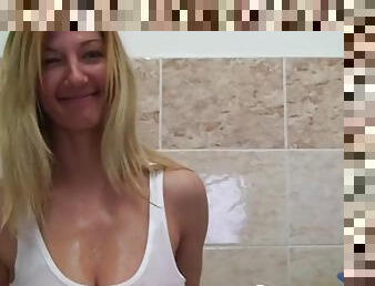 Blonde with big tits teases the camera