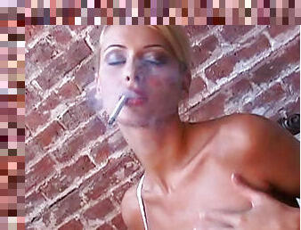 Zdenka Podkapova smokes a cigarette in a sexy style
